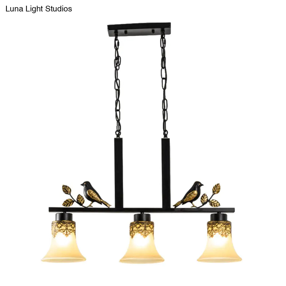 Black Island Pendant With 3 Tan Glass Shades And Bird Deco - Traditional Dining Room Ceiling Light