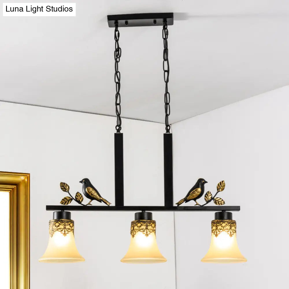 Black Island Pendant With 3 Tan Glass Shades And Bird Deco - Traditional Dining Room Ceiling Light