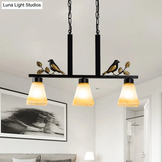 Black Island Pendant With 3 Tan Glass Shades And Bird Deco - Traditional Dining Room Ceiling Light