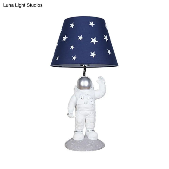 Blue Empire Shade Night Lamp - Kids Star Patterned Fabric Table Lighting With Carved Spaceman Base