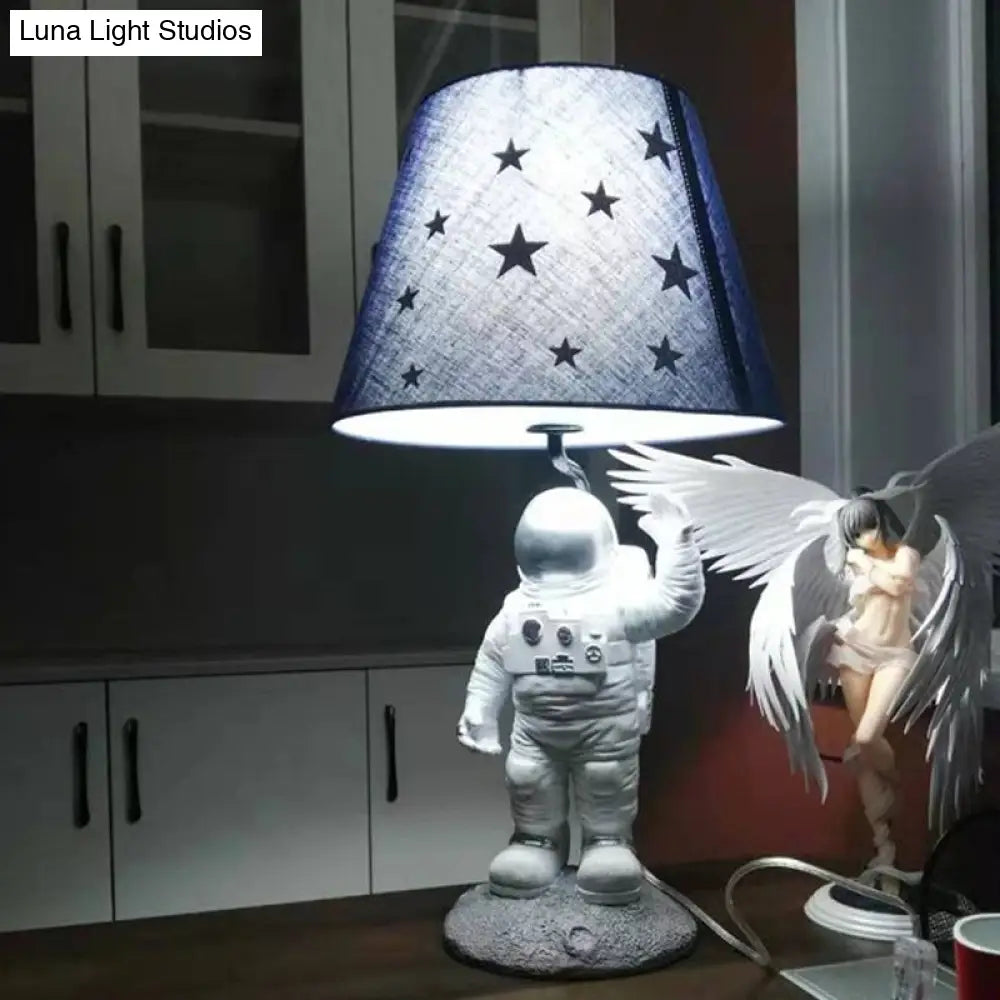 Blue Empire Shade Night Lamp - Kids Star Patterned Fabric Table Lighting With Carved Spaceman Base