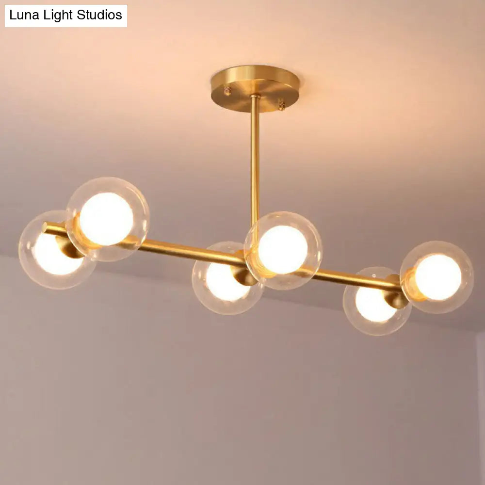 Brass Finish 6-Light Postmodern Linear Island Pendant With Glass Ball Shade