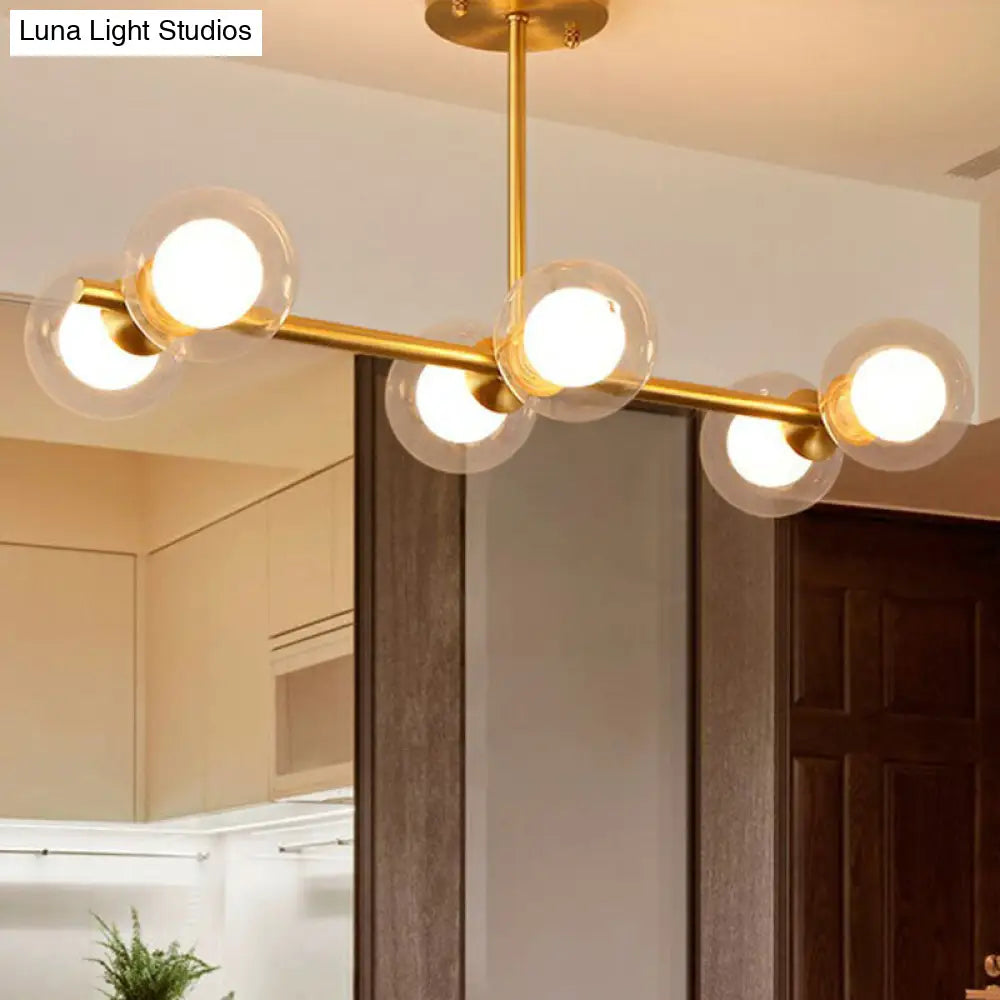 Brass Finish 6-Light Postmodern Linear Island Pendant With Glass Ball Shade