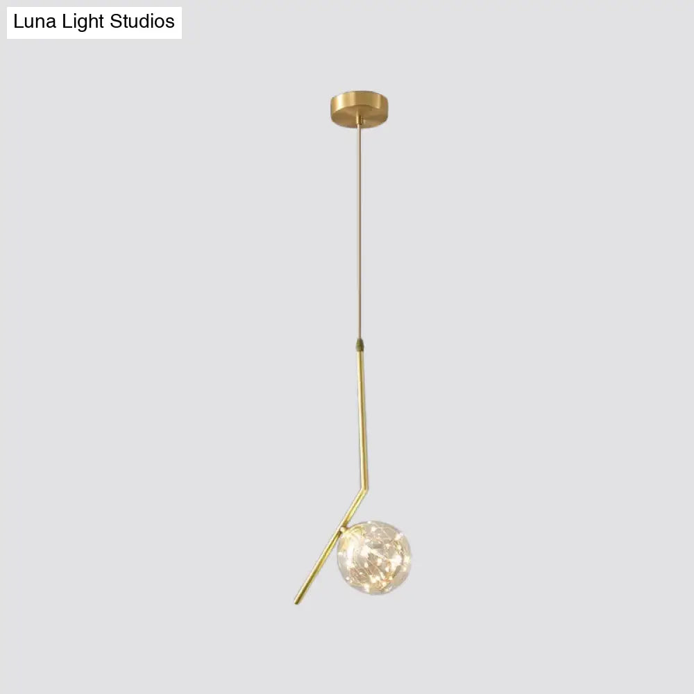 Sleek Brass Sphere Led Pendant Lamp For Modern Dining Rooms