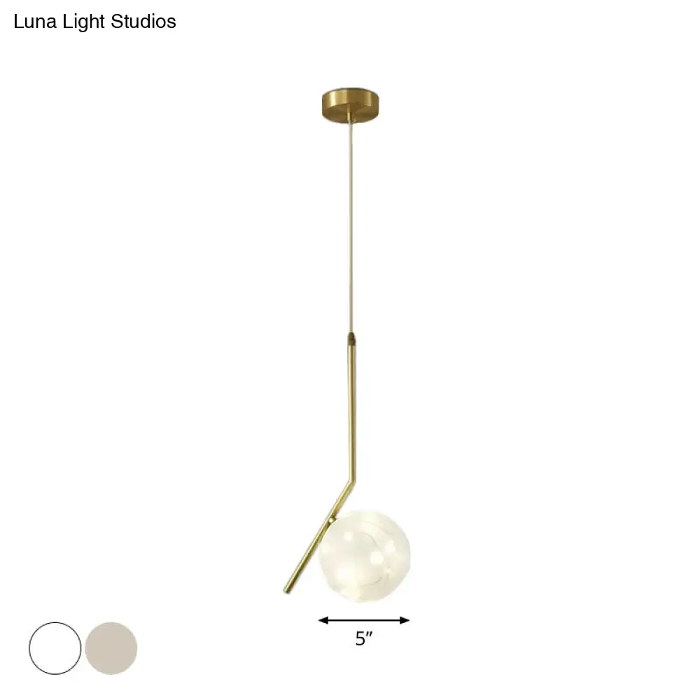 Sleek Brass Sphere Led Pendant Lamp For Modern Dining Rooms