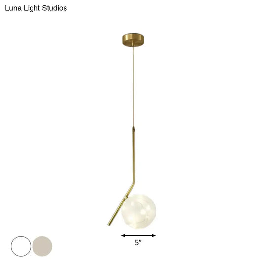 Sleek Brass Sphere Led Pendant Lamp For Modern Dining Rooms