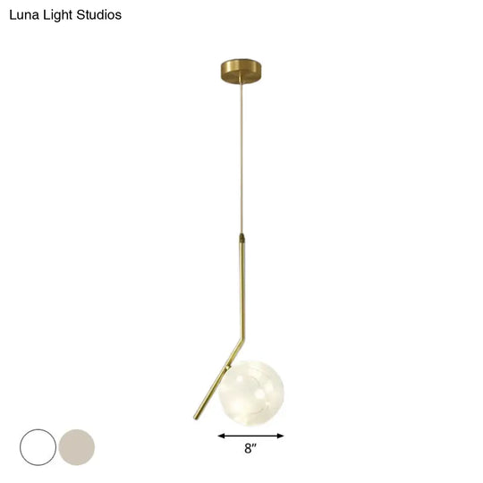 Sleek Brass Sphere Led Pendant Lamp For Modern Dining Rooms