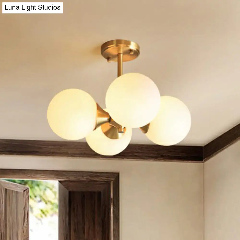 Brass Globe Semi Flush Mount Light With Opal Glass - Postmodern Design For Bedroom