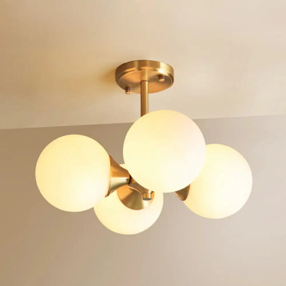 Brass Globe Semi Flush Mount Light With Opal Glass - Postmodern Design For Bedroom