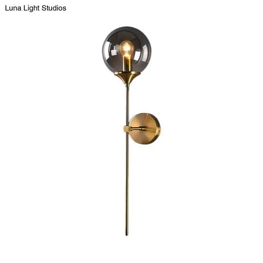 Brass Globe Shade Wall Sconce - Modern Single Bulb Clear/Grey/Amber Glass Light For Bedroom