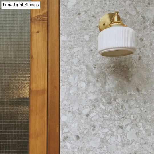 Brass Pivot Joint Foyer Sconce: Round Ribbed Glass Wall Light With White Simplicity (1 Bulb)