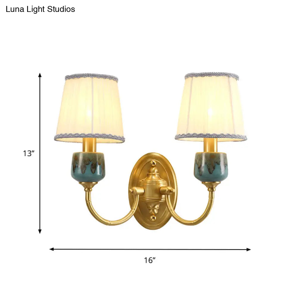 Brass Wall Hanging Light With Classic Swooping Arm And Fabric Shade