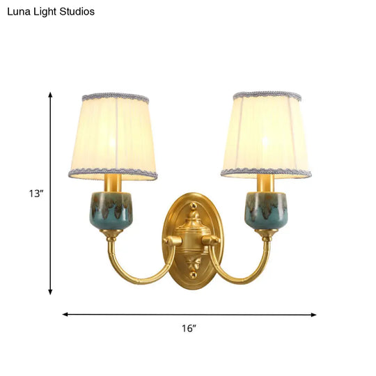 Brass Wall Hanging Light With Classic Swooping Arm And Fabric Shade