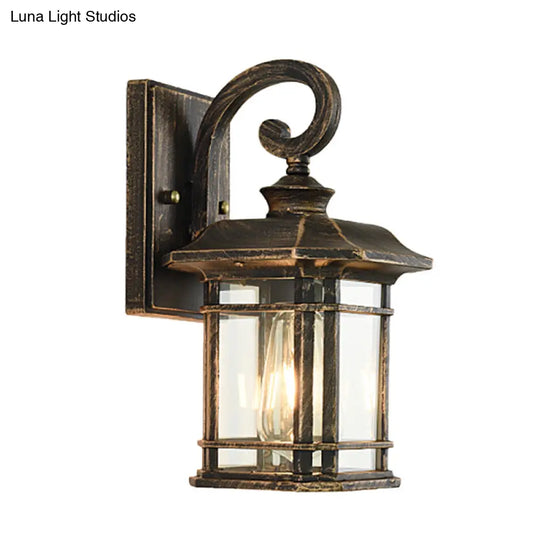 Bronze Curvy Arm Outdoor Wall Sconce With Clear Ripple Glass