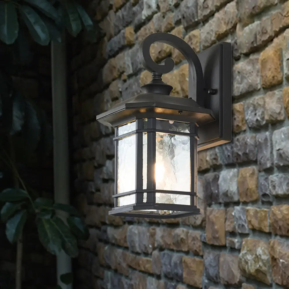 Bronze Curvy Arm Outdoor Wall Sconce With Clear Ripple Glass Black