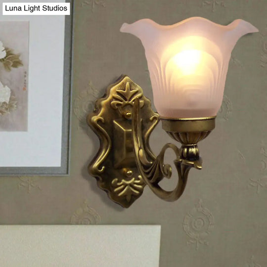 Bronze Floral Wall Sconce With White Glass Shade And Curvy Arm