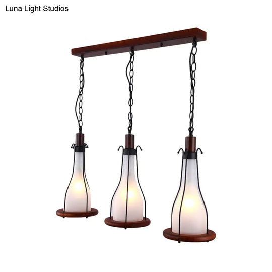 Industrial Chic 3-Light Cluster Pendant With Brown Bottles And Yellow/White Glass For Dining Room