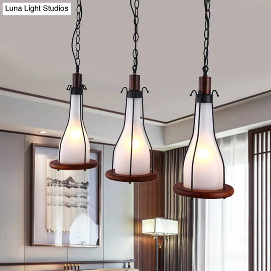 Industrial Chic 3-Light Cluster Pendant With Brown Bottles And Yellow/White Glass For Dining Room