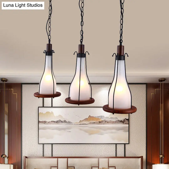 Industrial Chic 3-Light Cluster Pendant With Brown Bottles And Yellow/White Glass For Dining Room