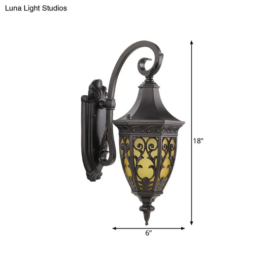 Classic 1-Light Outdoor Wall Hanging Light In Black With Metal Curving Design And Urn Yellow Glass