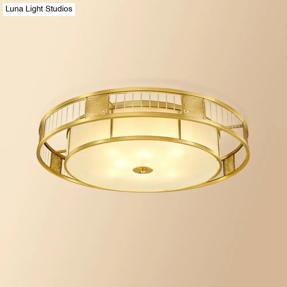 Classic Cream Glass Drum Flush Mount Light With Gold Finish And Cutout Metal Decor - Ideal For