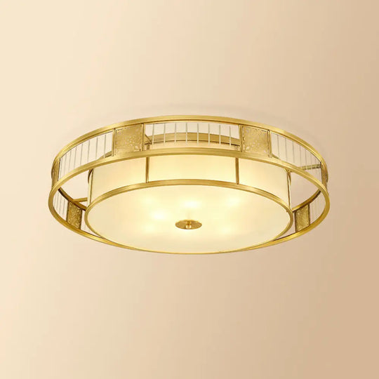 Classic Cream Glass Drum Flush Mount Light With Gold Finish And Cutout Metal Decor - Ideal For