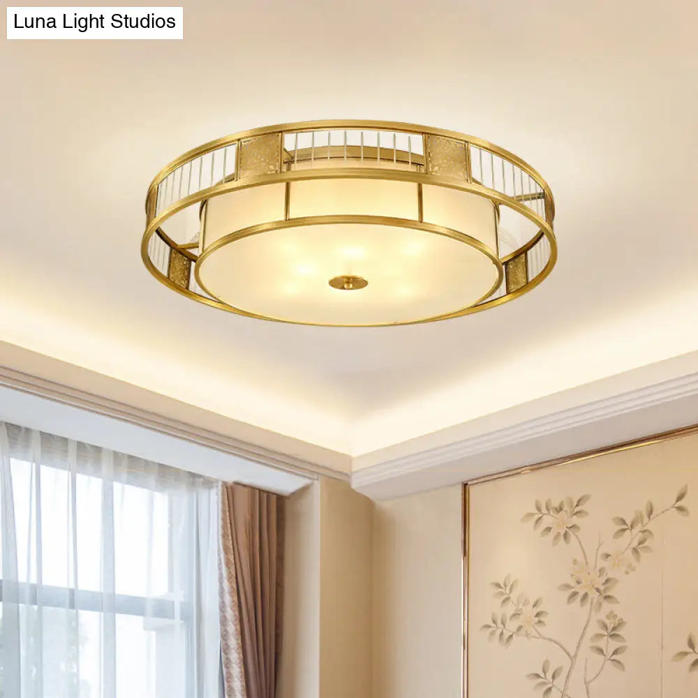 Classic Cream Glass Drum Flush Mount Light With Gold Finish And Cutout Metal Decor - Ideal For