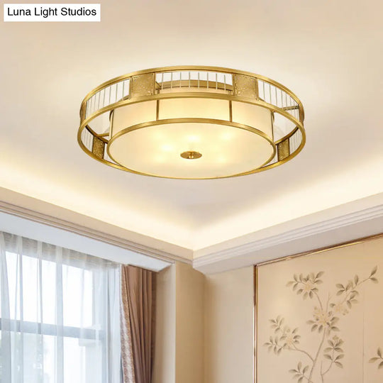 Classic Cream Glass Drum Flush Mount Light With Gold Finish And Cutout Metal Decor - Ideal For