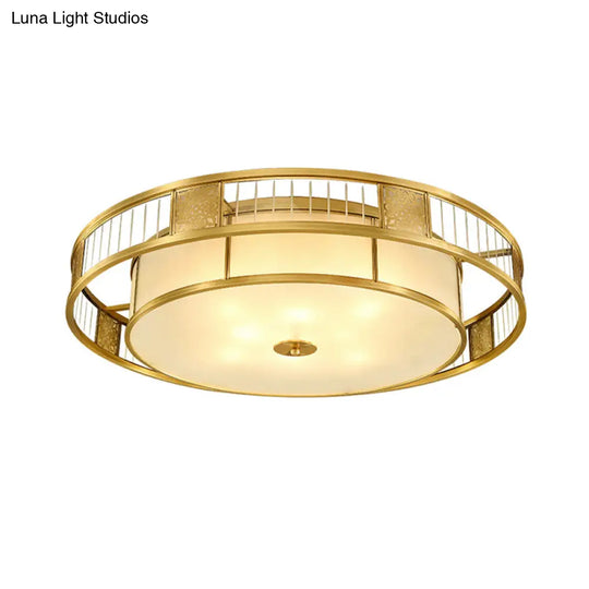 Classic Cream Glass Drum Flush Mount Light With Gold Finish And Cutout Metal Decor - Ideal For