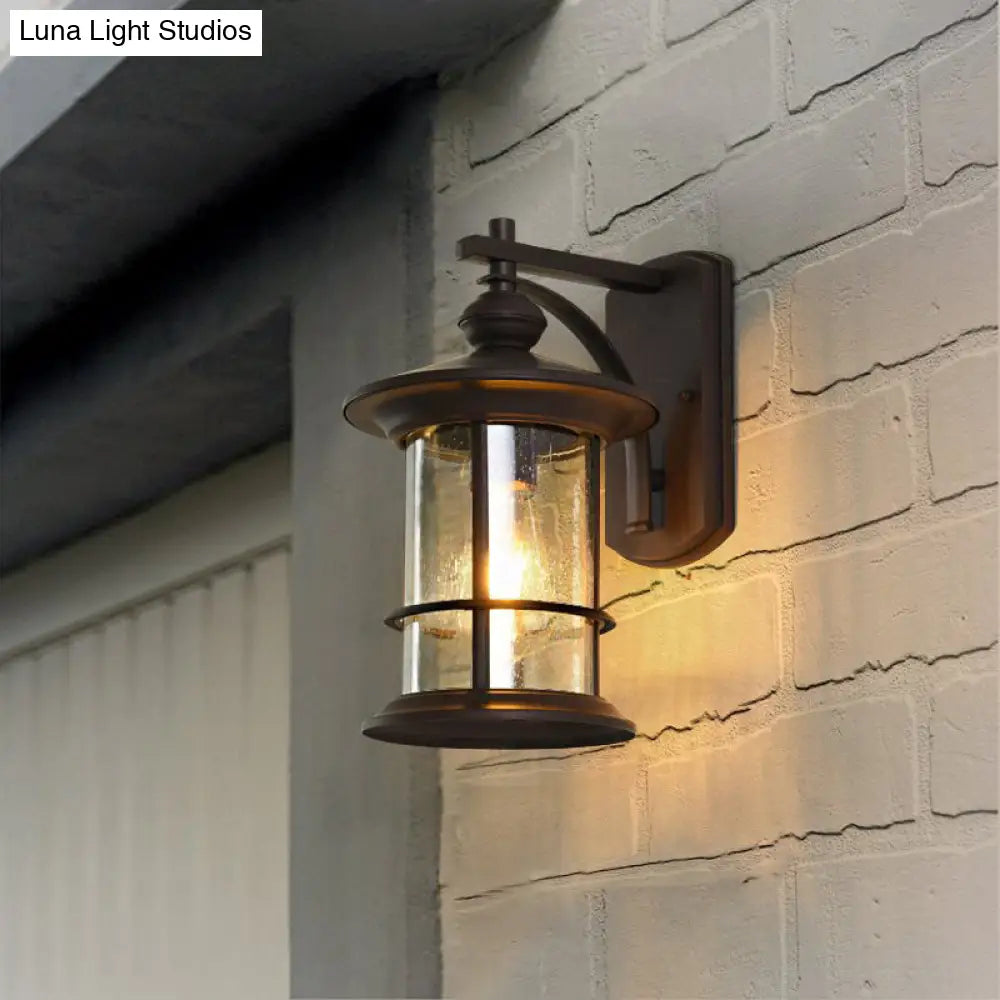 Clear Seeded Glass Cylinder Sconce Outdoor Wall Mounted Lamp For Garden - 1-Bulb Black/Coffee Finish