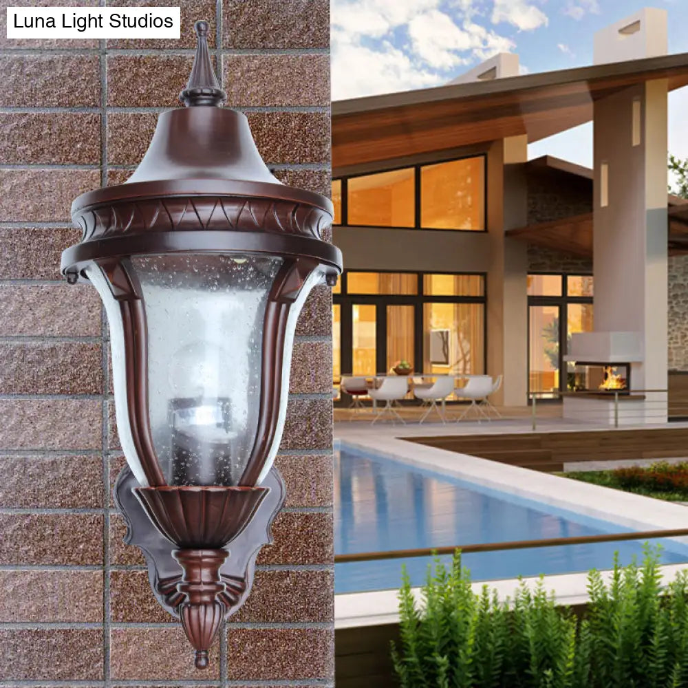 Clear Seedy Glass Wall Lamp With Retro Rust Urn Shade - Outdoor Lighting Idea