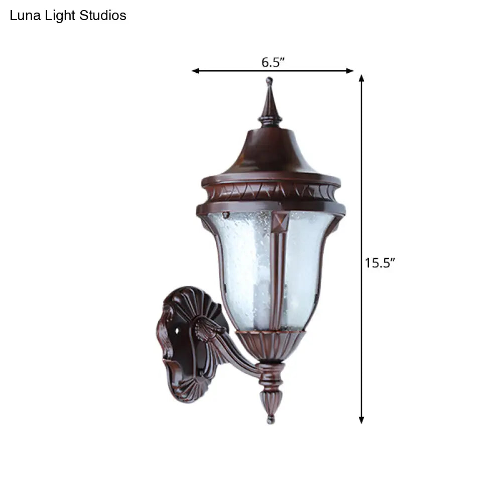 Clear Seedy Glass Wall Lamp With Retro Rust Urn Shade - Outdoor Lighting Idea