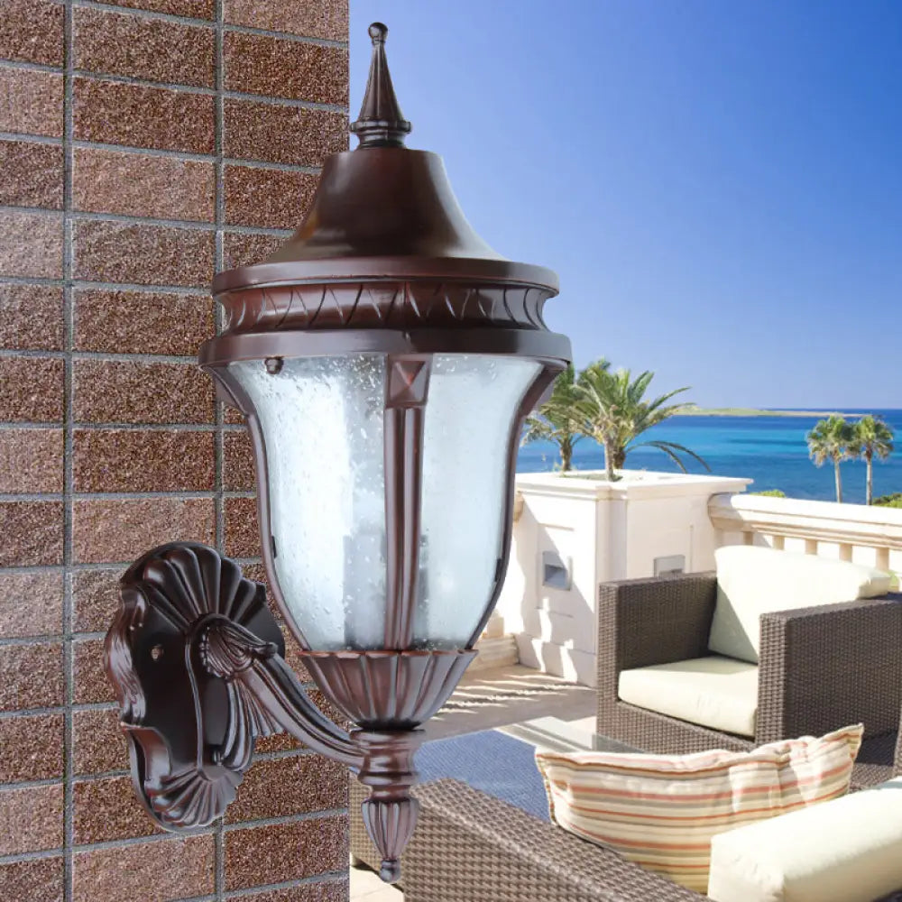 Clear Seedy Glass Wall Lamp With Retro Rust Urn Shade - Outdoor Lighting Idea