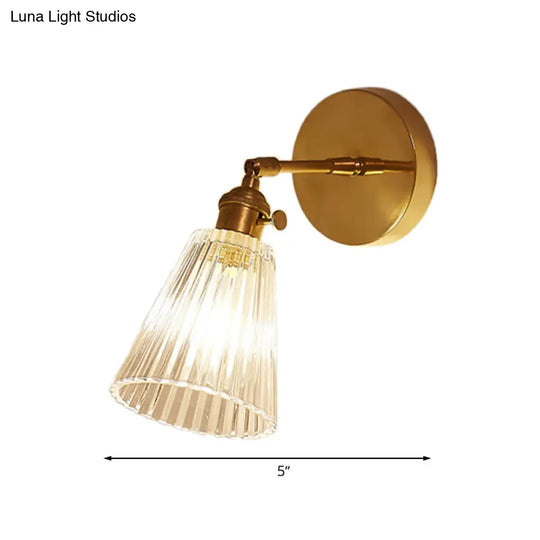 Clear Textured Glass Wall Sconce With Brass Accents For Industrial Dining Room Lighting