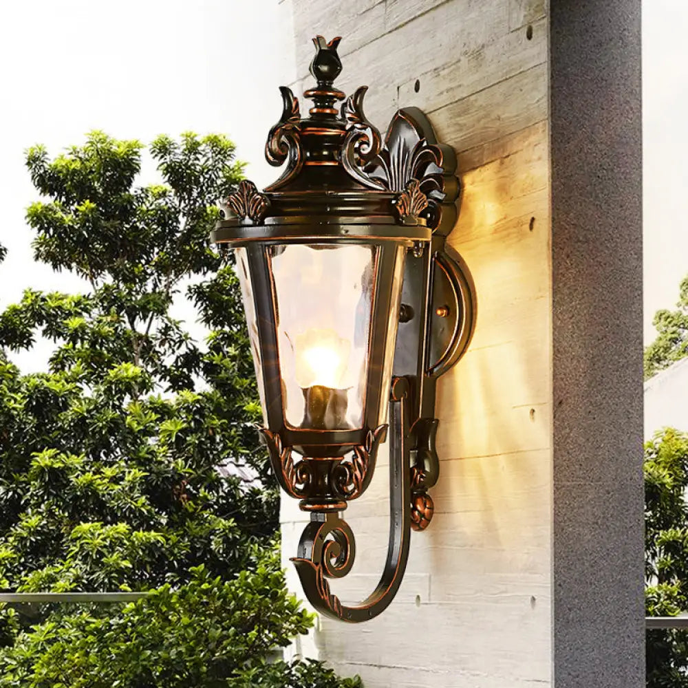 Clear Water Glass Outdoor Wall Sconce: Scrolled Arm 1-Light Black & Gold Lodge Lighting Black-Gold