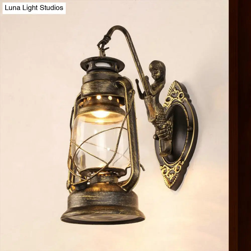 Coastal Bedroom Wall Light With Lantern Shade - Clear Glass Sconce In Black/Antique Brass/Weathered