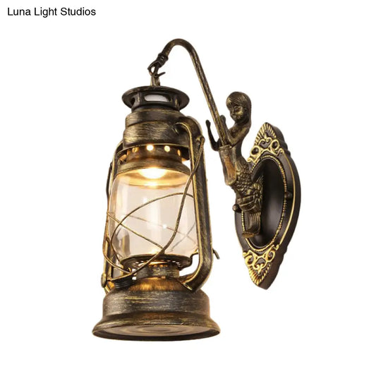 Coastal Bedroom Wall Light With Lantern Shade - Clear Glass Sconce In Black/Antique Brass/Weathered