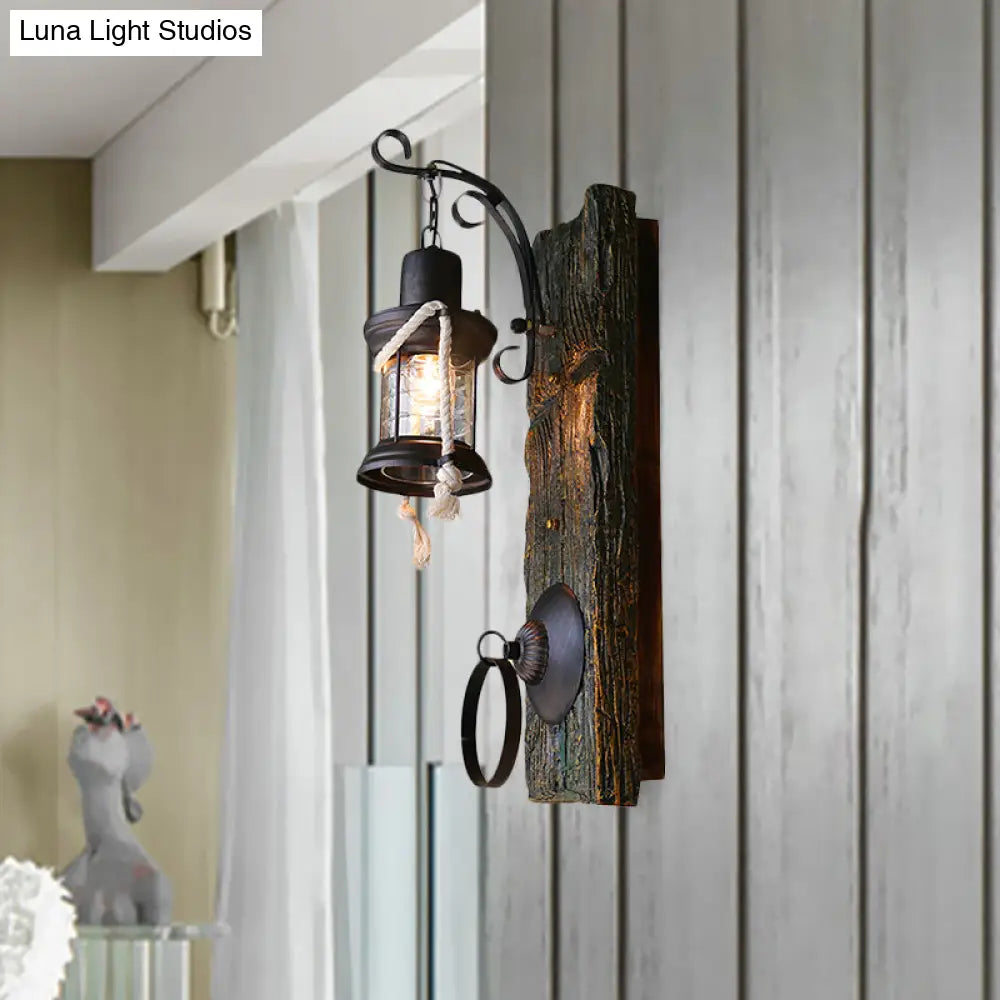 Coastal Black Kerosene Sconce With Clear Glass Bulb And Wooden Backplate For Outdoor Lighting