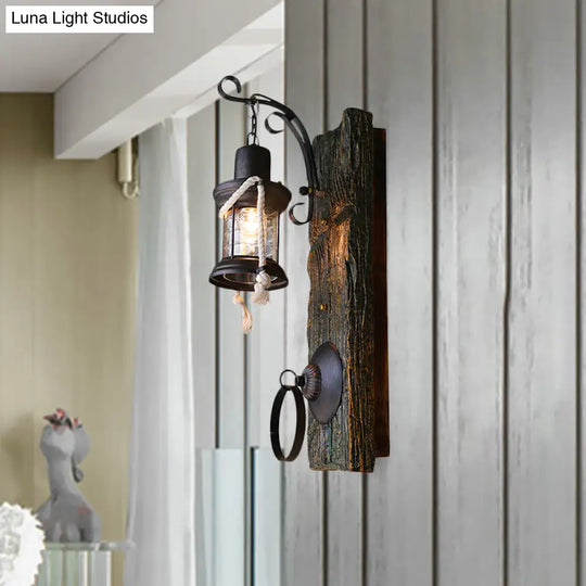 Coastal Black Kerosene Sconce With Clear Glass Bulb And Wooden Backplate For Outdoor Lighting