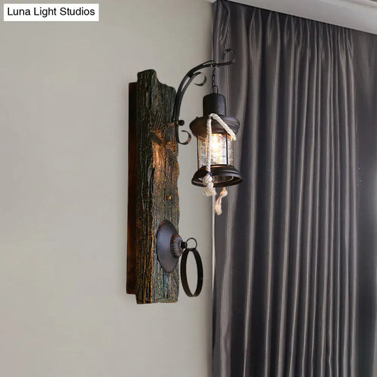 Coastal Black Kerosene Sconce With Clear Glass Bulb And Wooden Backplate For Outdoor Lighting