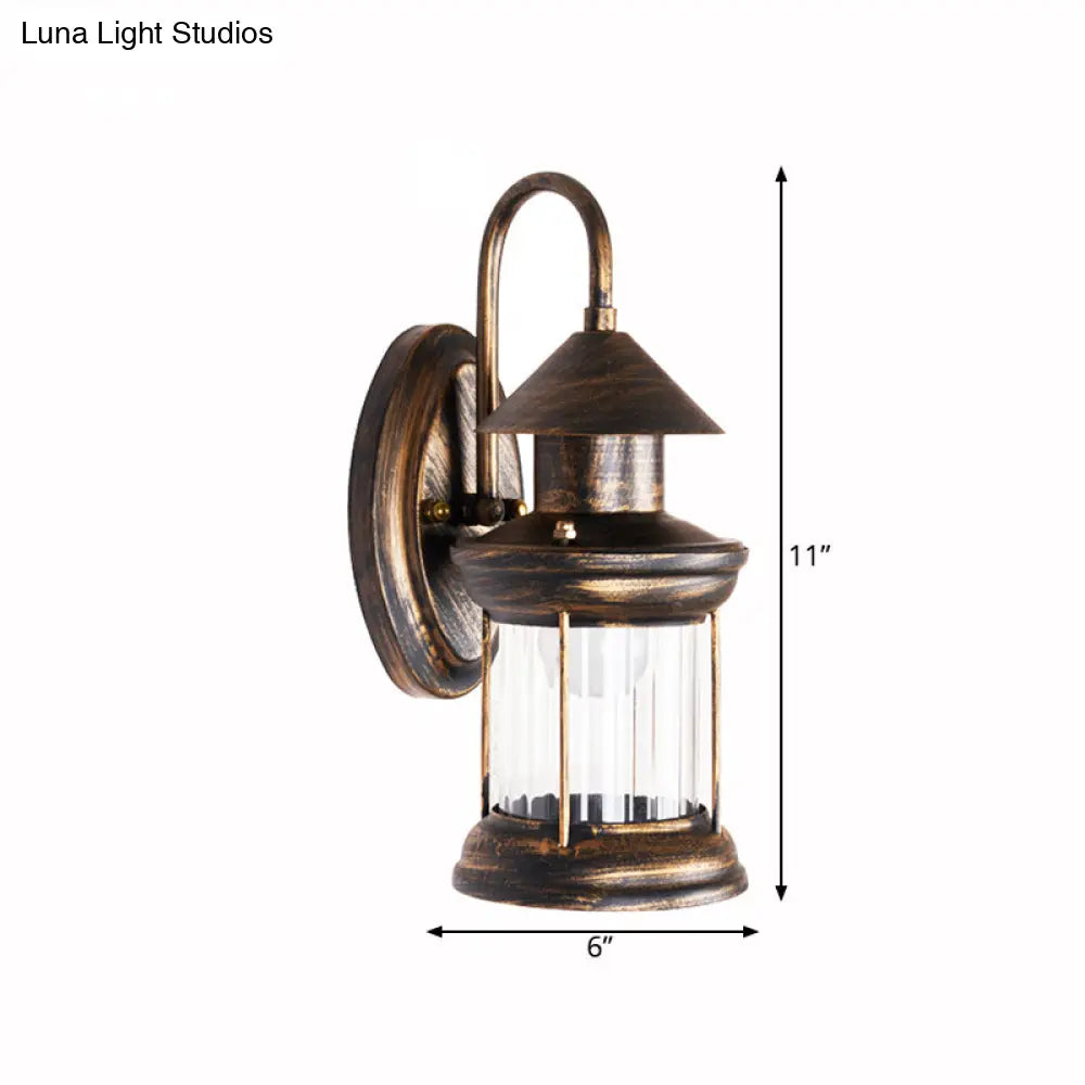 Coastal Brass Metallic Lantern Wall Mount Lamp With Curvy Arm - 1 Bulb Sconce