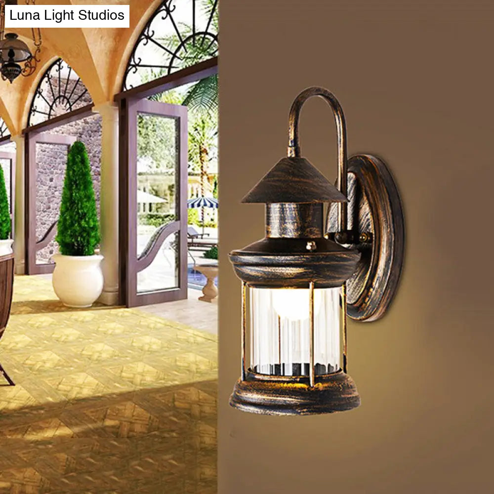 Coastal Brass Metallic Lantern Wall Mount Lamp With Curvy Arm - 1 Bulb Sconce