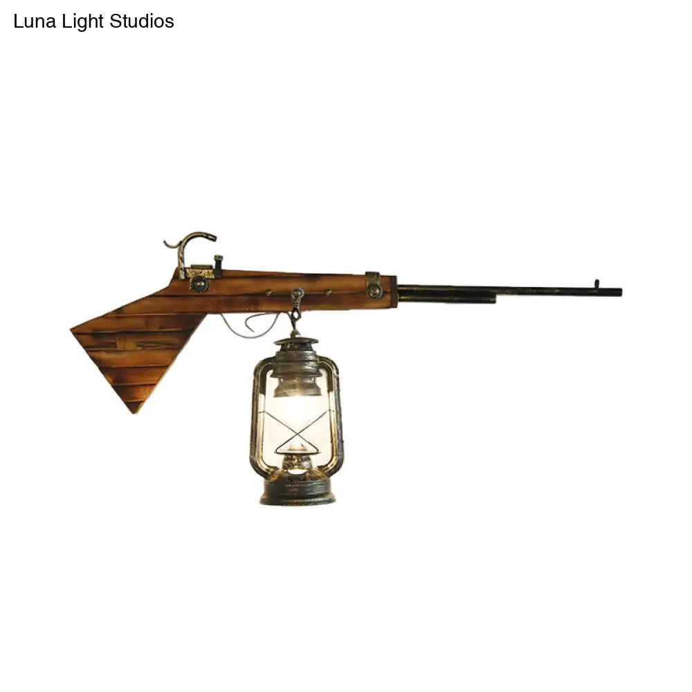 Coastal Bronze Lantern Wall Mounted Light With Clear Glass And Gun Decoration