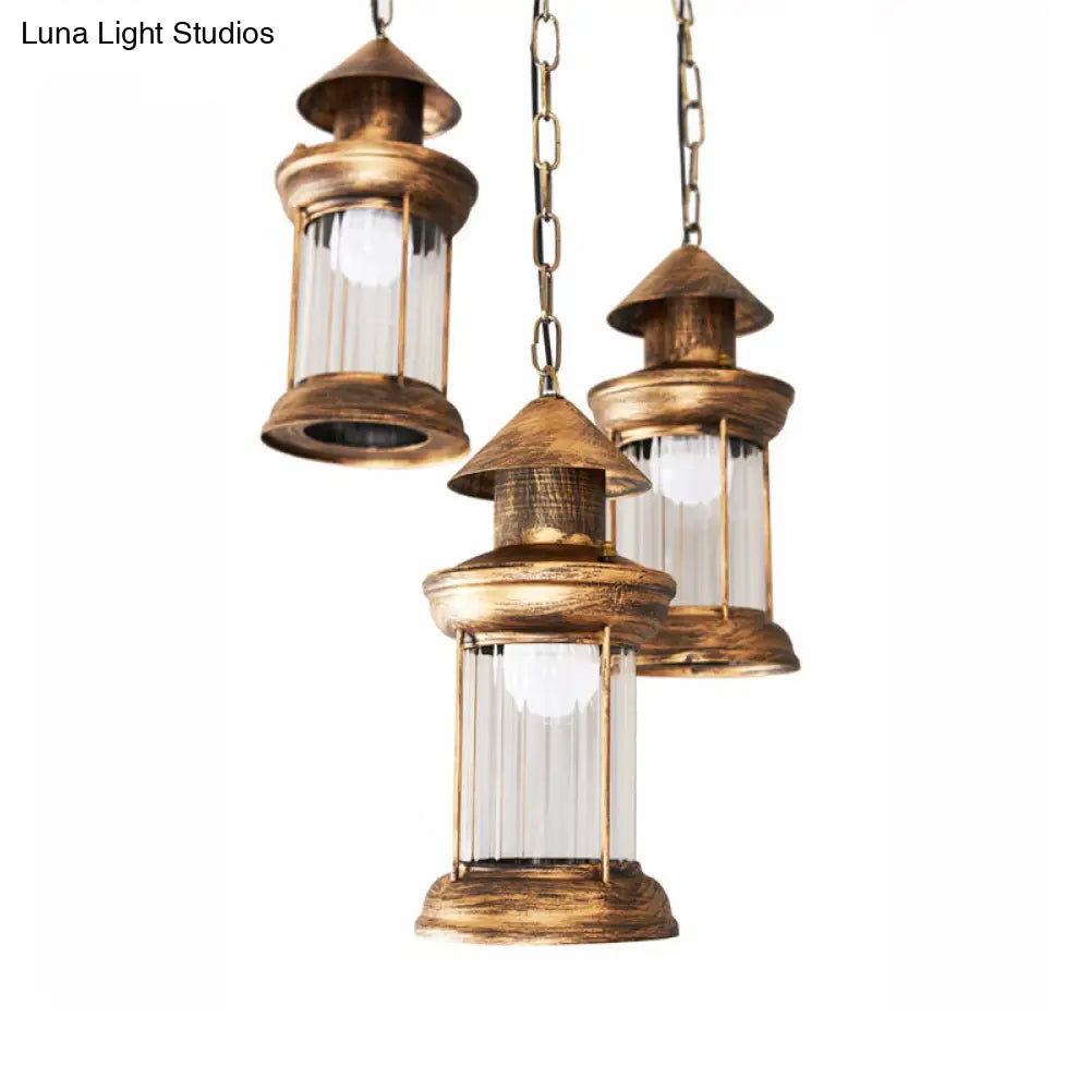 Coastal Kerosene 3-Head Pendant Lamp In Brass With Clear Ribbed Glass Shade