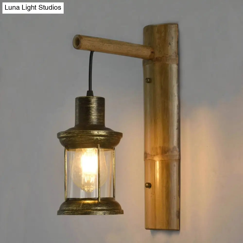 Coastal Lantern 1-Head Wall Light Sconce With Clear Glass And Bamboo Backplate