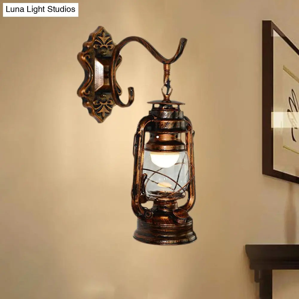 Coastal Living Room Wall Sconce - Clear Glass Light In Bronze Finish