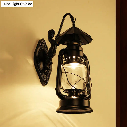 Coastal Single Bulb Kerosene Glass Wall Sconce In Black/Antique Brass For Living Room