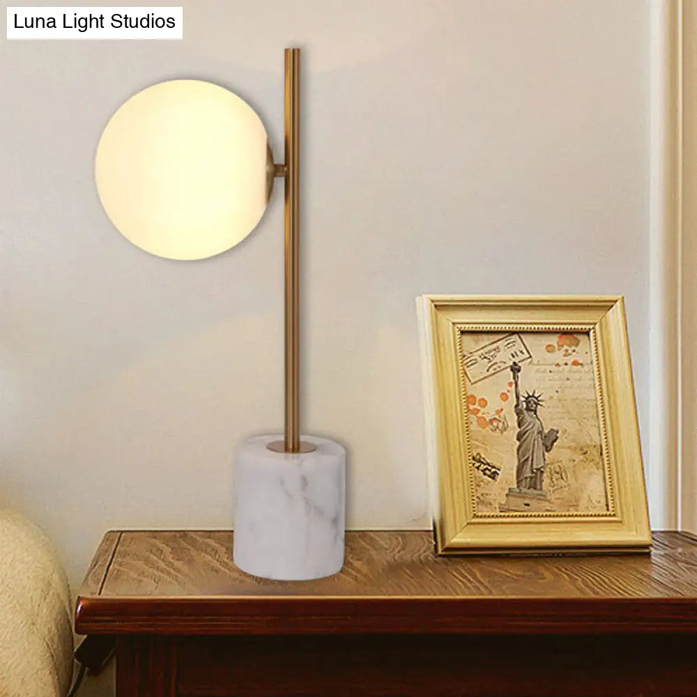 Simple White Glass Ball Night Lamp With Brass Pole And Marble Base