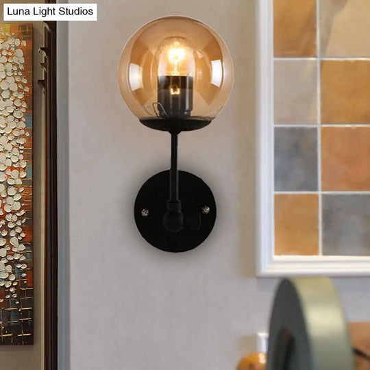 Contemporary Black Wall Sconce With Globe Glass Shade