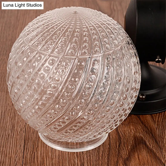 Contemporary Black/White Sconce Light With Globe Lattice Glass Shade - 1 Passage Wall Lighting